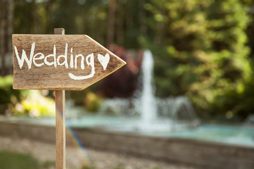 wedding written in chalk pointing to the right