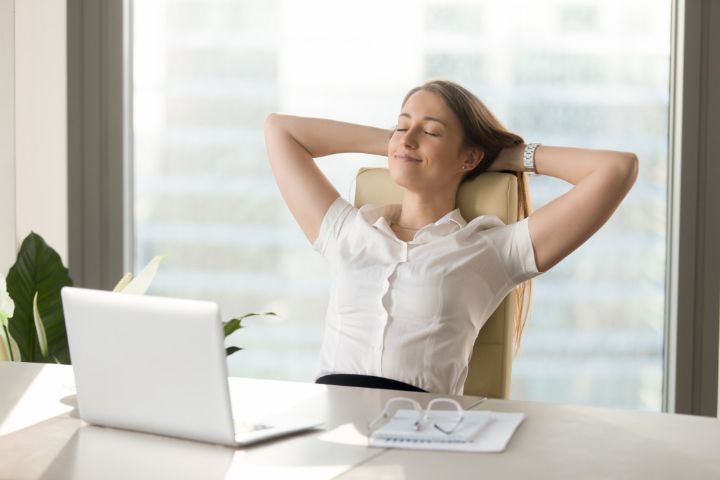 relaxed female employee in her office