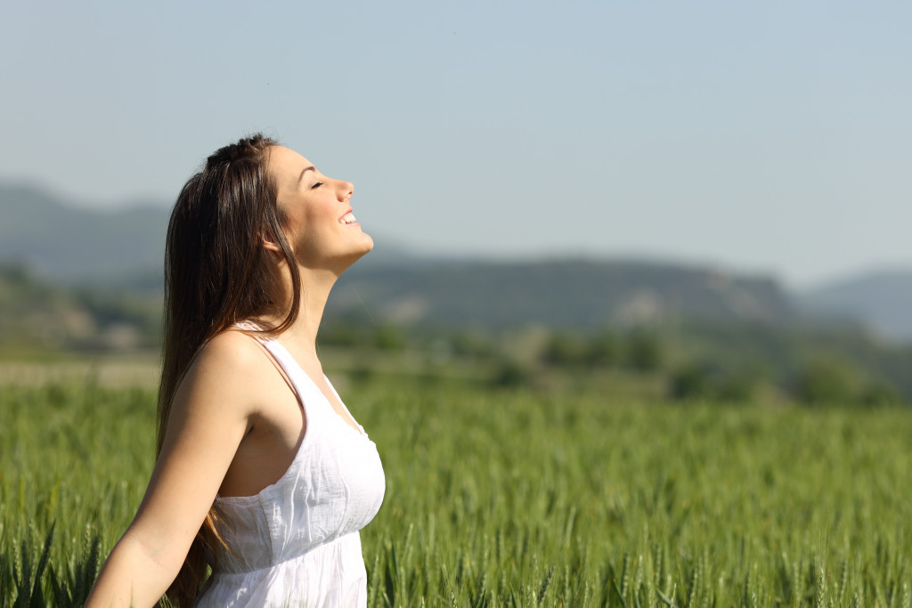 a woman enjoying the fresh air